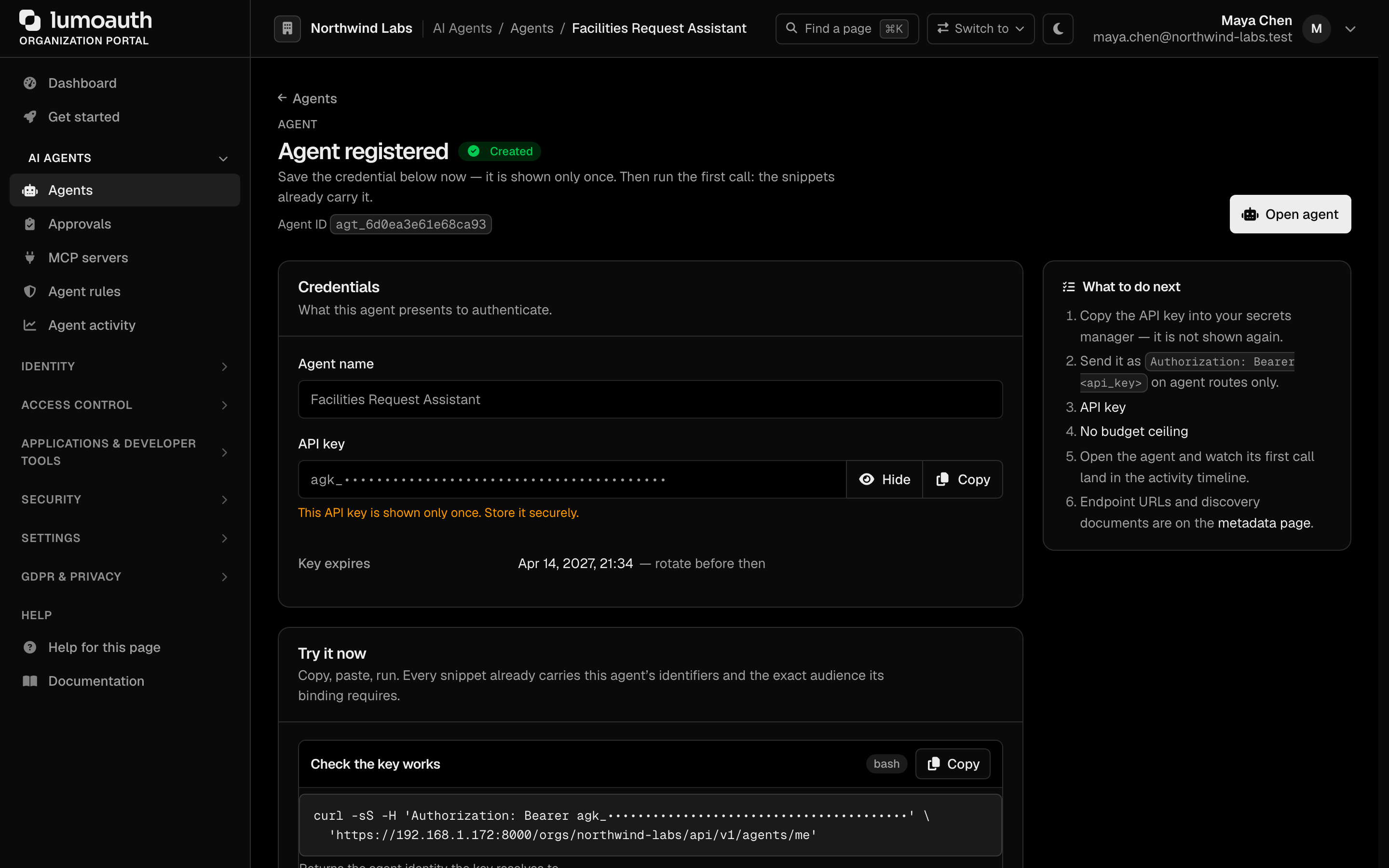 The Agent registered page showing the one-time API key (masked here), its expiry and a runnable first call